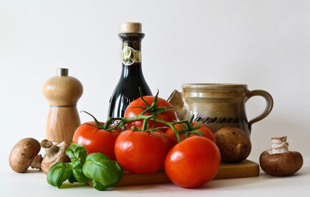 Ingredientes frescos sobre mesa rústica, evocando autenticidad y cuidado